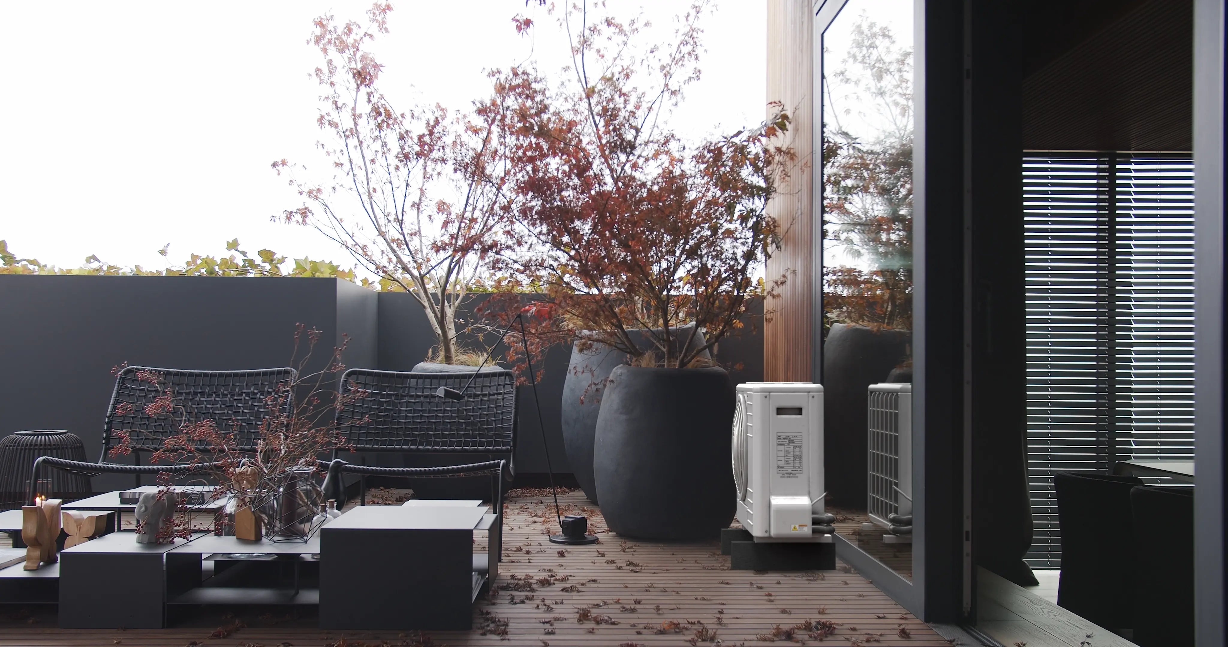 Uncovered Daikin RXM35R AC unit on terrace. See how the Blade cover transforms it with protection and style.
