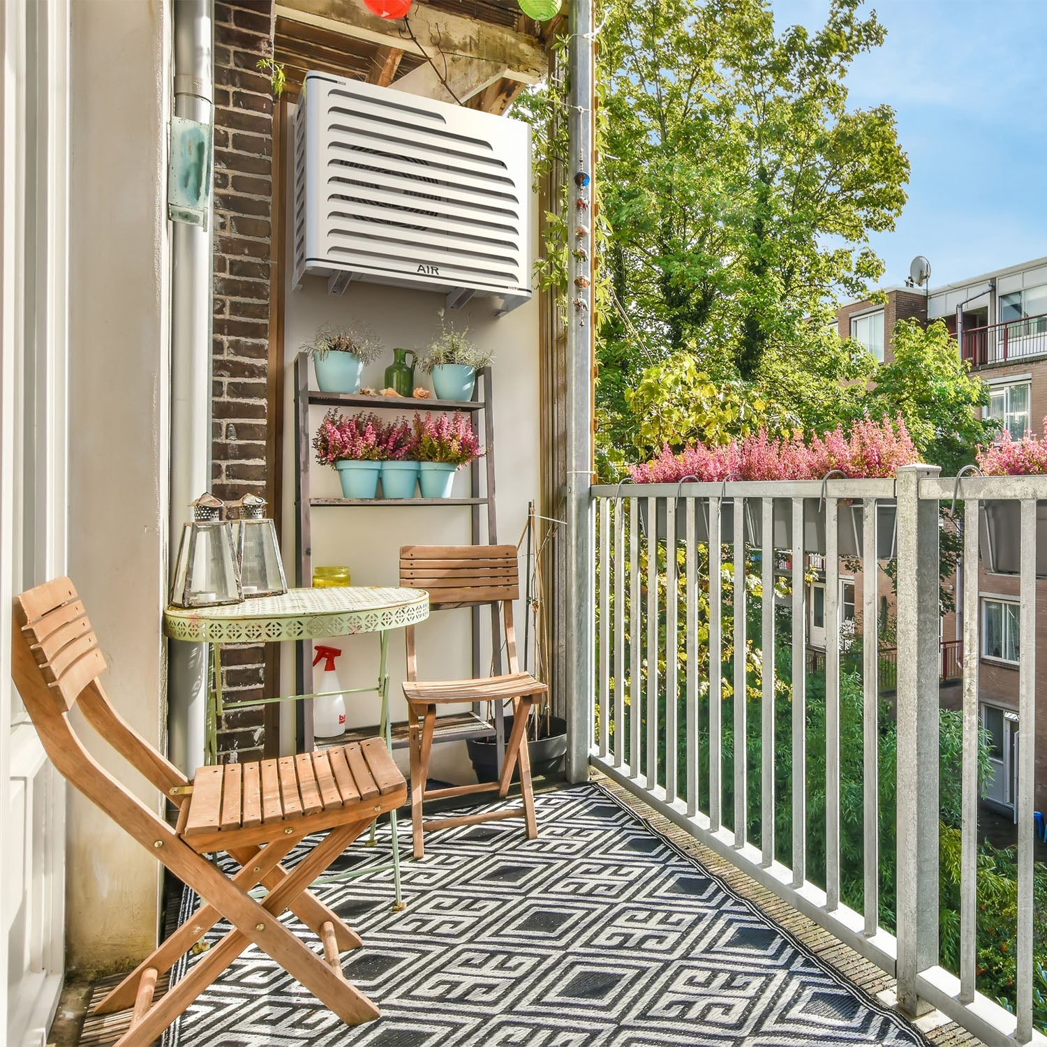 Bohemian style outdoor AC cover – Curve white installed on luxury balcony. Protection installed on Panasonic Aquarea, ideal for withstanding weather and blending into the outdoor environment.